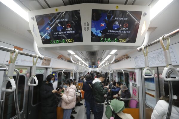 FILE - This Jan. 29, 2020, file photo shows screens warning about a new coronavirus in a subway train in Seoul, South Korea. The dangerous virus spreading through China threatens a wide range of industries with global ties to the world’s second largest economy. Chinese authorities have cut off access to Wuhan, where the virus originated, and 16 other cities to prevent further spread of the virus, affecting more than 50 million people. (AP Photo/Ahn Young-joon, File)