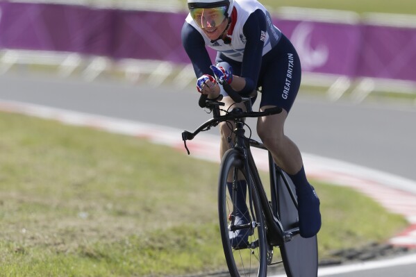 FILE - Sarah Story of Britain competes in her women's road cycling C5 category time trial at the 2012 Paralympics games, Wednesday, Sept. 5, 2012, at Brands Hatch motor racing circuit near London. (AP Photo/Alastair Grant, File)