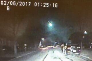 
              This image from a dashcam video provided by the Lisle Police Department in Lisle, Ill., shows a meteor as it streaked over Lake Michigan early Monday morning, Feb. 6, 2017. The meteor lit up the sky across several states in the Midwest. (Lisle (Ill.) Police Department via AP)
            
