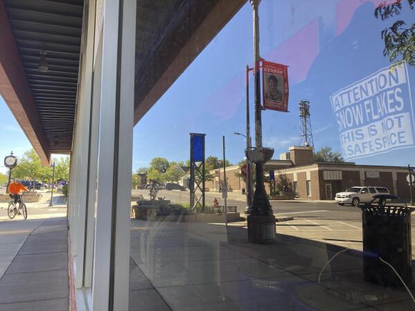 A storefront in downtown Gillette, Wyo., displays a shirt with a political statement on Tuesday, Sept. 21, 2021. Wyoming has the lowest COVID-19 vaccination rate in the U.S. and the Gillette area has one of the lowest rates in Wyoming. (AP Photo/Mead Gruver)