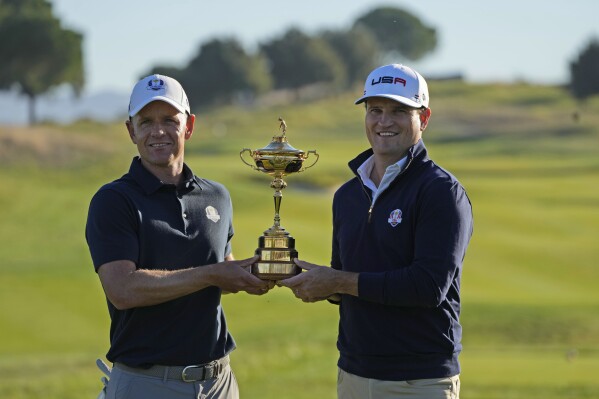 FILE - European Captain Luke Donald, left, and United States Captain Zach Johnson pose with the Ryder Cup trophy at the Marco Simone course that will host the 2023 Ryder Cup, in Guidonia Montecelio, Italy, Monday, Oct. 3, 2022. (AP Photo/Alessandra Tarantino, File)