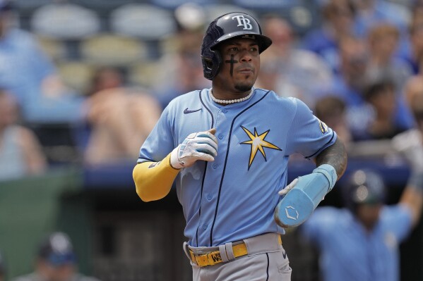FILE - Tampa Bay Rays' Wander Franco runs home to score on a two-run single hit by Luke Raley during the eighth inning of the first game of a baseball doubleheader against the Kansas City Royals, Saturday, July 15, 2023, in Kansas City, Mo. Wander Franco remains away from the Tampa Bay Rays as they prepare for the postseason, leaving the team without one of its most dynamic young players amid investigations into an alleged relationship between Franco and a minor.(AP Photo/Charlie Riedel, File)