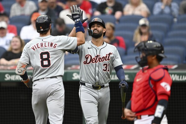 Detroit Tigers' Matt Vierling (8) and Riley Greene (31) celebrate a solo home run hit by Vierling during the first inning of a baseball game against the Cleveland Guardians, Wednesday, July 24, 2024, in Cleveland. (ĢӰԺ Photo/Nick Cammett)