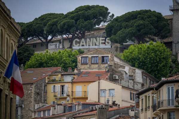 The Cannes sign is pictured above the old town ahead of the the 77th international film festival, Cannes, southern France, Monday, May 13, 2024. The Cannes film festival runs from May 14 until May 25, 2024. (AP Photo/Andreea Alexandru)