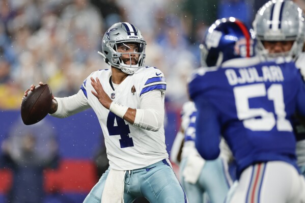Dallas Cowboys quarterback Dak Prescott throws during the first half of an NFL football game against the New York Giants, Sunday, Sept. 10, 2023, in East Rutherford, N.J. (AP Photo/Adam Hunger)