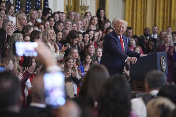 Women and girls look on as President Donald Trump speaks before signing an executive order barring transgender female athletes from competing in women's or girls' sporting events, in the East Room of the White House, Wednesday, Feb. 5, 2025, in Washington.(AP Photo/ Evan Vucci, File)