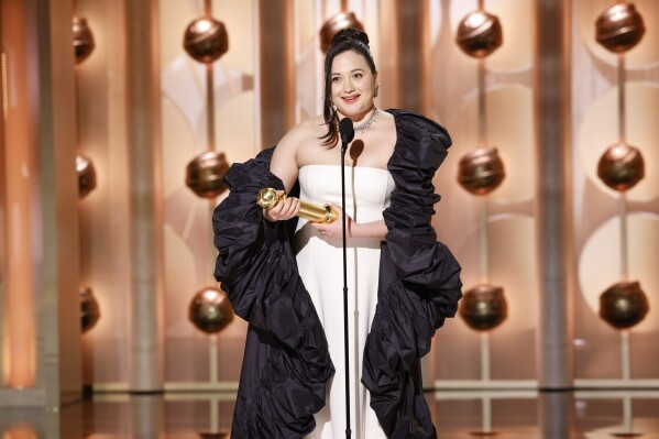 This image released by CBS shows Lily Gladstone as she accepts the award for best female actor in motion picture - drama for her role in "Killers of the Flower Moon" during the 81st Annual Golden Globe Awards in Beverly Hills, Calif., on Sunday, Jan. 7, 2024. (Sonja Flemming/CBS via AP)