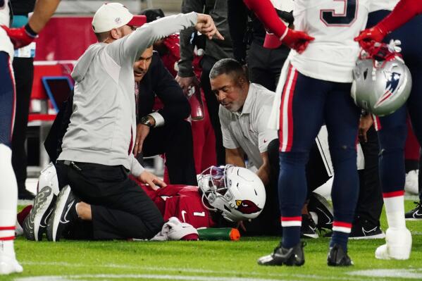 Arizona Cardinals quarterback Kyler Murray (1) lies on the ground after an injury during the first half of an NFL football game against the New England Patriots, Monday, Dec. 12, 2022, in Glendale, Ariz. (AP Photo/Darryl Webb)