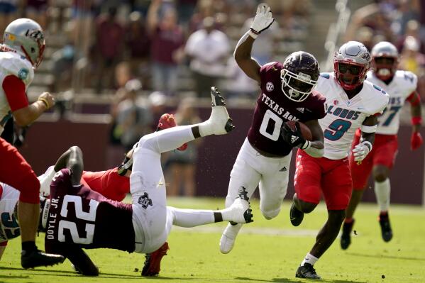 Texas A&M wide receiver Ainias Smith (0) dives for yardage against New Mexico during the during the first quarter of an NCAA college football game on Saturday, Sept. 18, 2021, in College Station, Texas. (AP Photo/Sam Craft)