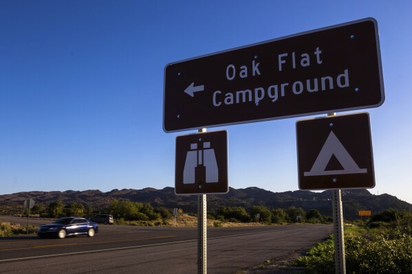 A sign marks the entrance to Oak Flat Campground, a sacred site for Native Americans located 70 miles east of Phoenix, on June 3, 2023, in Miami, Ariz. (AP Photo/Ty O'Neil)