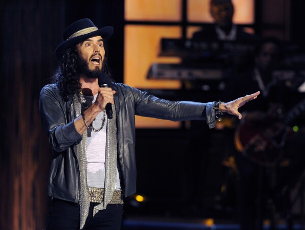 Russell Brand: UK police urged to investigate sex assault allegations  against comedian | AP News