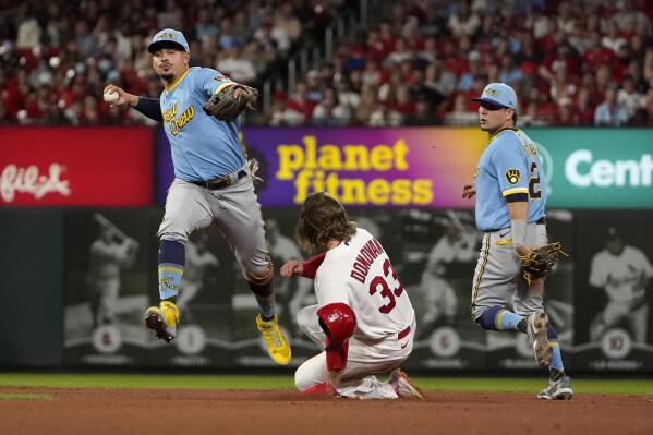 St. Louis Cardinals' Brendan Donovan (33) is forced out at second by Milwaukee Brewers shortstop Willy Adames as Brewers second baseman Luis Urias, right, watches during the fourth inning of a baseball game Tuesday, Sept. 13, 2022, in St. Louis. (AP Photo/Jeff Roberson)