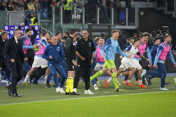 Lazio players cheer after scoring during the Italian Serie A