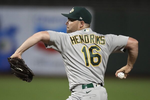 FILE - Oakland Athletics pitcher Liam Hendriks works against the San Francisco Giants in the 10th inning of a baseball game in San Francisco, in this Friday, Aug. 14, 2020, file photo. Hendriks is a free agent. (AP Photo/Ben Margot, File)