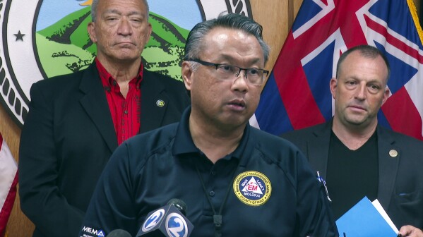 In this image taken from video, Maui Emergency Management Agency Administrator Herman Andaya speaks during a news conference in Wailuku, Hawaii, Wednesday, Aug. 16, 2023. (AP Photo/Mike Householder)