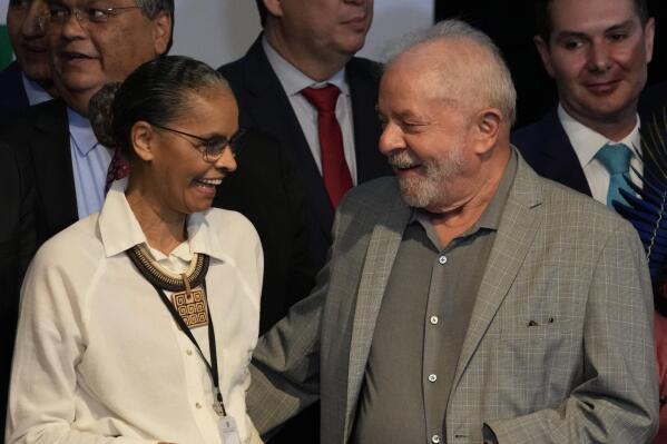 Brazil's President-elect Luiz Inacio Lula da Silva and newly-named Environment Minister Marina Silva, smile during a meeting where he announced the ministers for his incoming government, in Brasilia, Brazil, Thursday, Dec. 29, 2022. Lula will be sworn-in on Jan. 1, 2023. (AP Photo/Eraldo Peres)