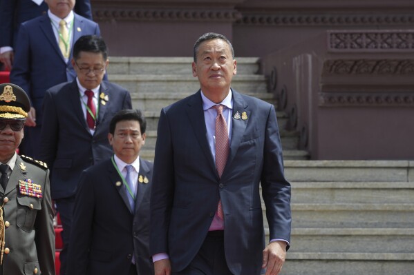 Thai Prime Minister Srettha Thavisin, right, walks after a ceremony at the Independence Monument in Phnom Penh, Cambodia, Thursday, Sept. 28, 2023. Srettha Thavisin is on his one day official visit to Cambodia. (AP Photo/Heng Sinith)