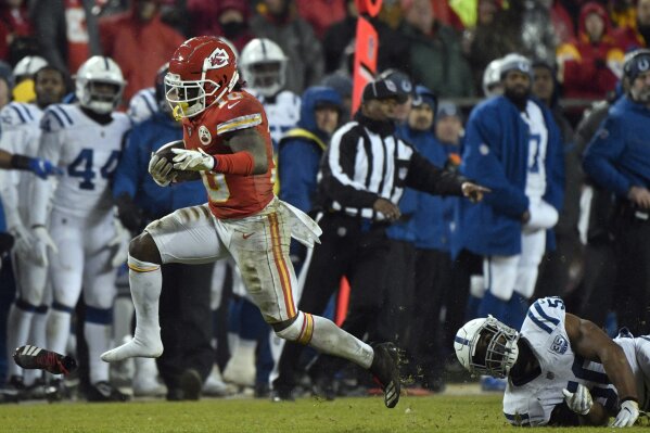 
              Kansas City Chiefs wide receiver Tyreek Hill (10) loses his shoe as he runs past Indianapolis Colts linebacker Anthony Walker (50) during the second half of an NFL divisional football playoff game against the Indianapolis Colts in Kansas City, Mo., Saturday, Jan. 12, 2019. (AP Photo/Ed Zurga)
            