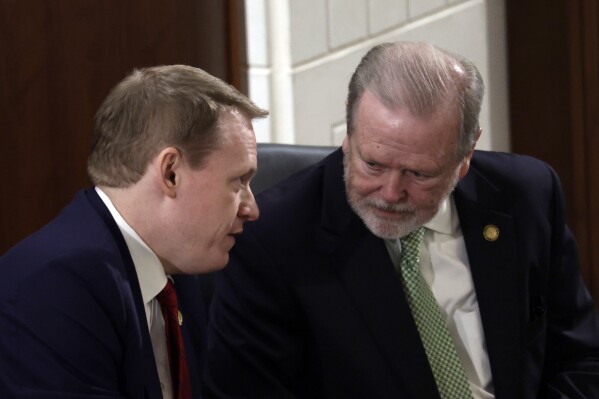 Speaker of the House Destin Hall, R-Caldwell, left, and Senate leader Phil Berger, R-Rockingham, right, confer before North Carolina Gov. Josh Stein, not pictured, delivers the State of the State address at the Legislative Building, Wednesday, March 12, 2025, in Raleigh N.C. (AP Photo/Chris Seward, File)