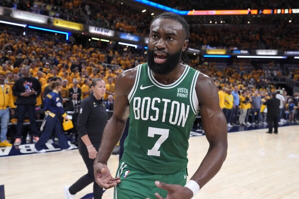 Boston Celtics guard Jaylen Brown (7) celebrates after Game 4 of the NBA Eastern Conference basketball finals against the Indiana Pacers, Monday, May 27, 2024, in Indianapolis. The Celtics won 105-102.(AP Photo/Michael Conroy)