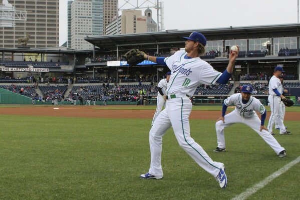 
              FILE - In this April 13, 2017 file photo, Hartford Yard Goats players warm up before the team's first ever game in Hartford, Conn. The Double-A team say they are going peanut-free at the 6,000-seat Dunkin' Donuts Park in 2019 to make the venue safer for people with nut allergies. (AP Photo/Pat Eaton-Robb, File)
            