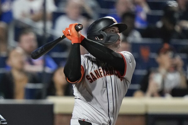 San Francisco Giants' Patrick Bailey watches his grand slam against the New York Mets during the eighth inning of a baseball game Friday, May 24, 2024, in New York. (AP Photo/Frank Franklin II)