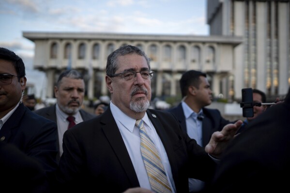 Guatemala's President-elect Bernardo Arévalo leaves at the end of a press conference in the Plaza of Human Rights in Guatemala City, Thursday, Nov. 16, 2023. Guatemalan prosecutors said Thursday they will seek to strip Arévalo and several members of his party of their immunity for allegedly making social media posts that encouraged students to take over a public university in 2022. (AP Photo/Santiago Billy)