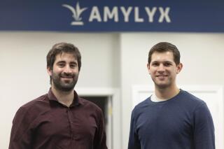 FILE - This 2018 photo provided by Amylyx shows the company's co-founders Joshua Cohen, left, and Justin Klee in Cambridge, Mass. on Sept. 2, 2022. A closely watched experimental drug for Lou Gehrig’s disease is getting an unusual second look from U.S. regulators on Wednesday, Sept. 7, 2022, amid intense pressure to approve the treatment for patients with the fatal illness. Patients and their families have rallied behind the drug from Amylyx Pharma, launching an aggressive lobbying campaign and enlisting members of Congress to push the Food and Drug Administration to grant approval. (Amylyx via AP, File)