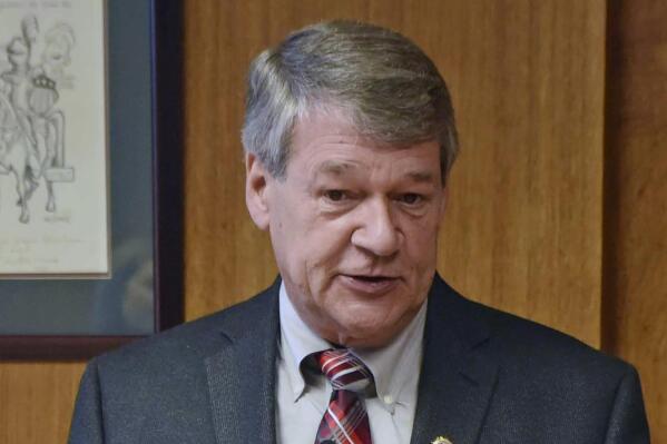 FILE - North Dakota Attorney General Wayne Stenehjem speaks in Bismarck, N.D. on July 18, 2019.  Stenehjem, a Republican who is the longest-serving attorney general in state history, said Friday, Dec. 17, 2021,  he will not seek reelection in 2022.(Tom Stromme/The Bismarck Tribune via AP File)