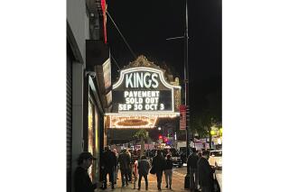 People gather outside of Kings Theatre on Sept. 30, 2022 where the band Pavement performed sold out shows in the Brooklyn borough of New York. (AP Photo/Jake O’Connell)