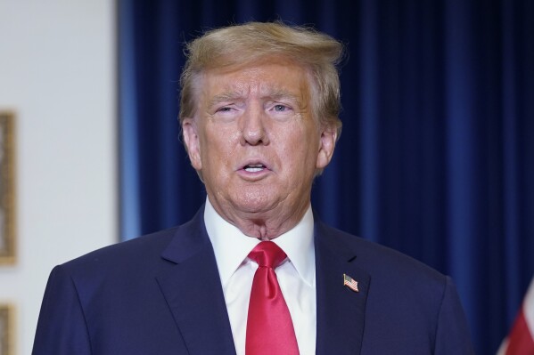 Former President Donald Trump speaks to the media at a Washington hotel, Tuesday, Jan. 9, 2024, after attending a hearing before the D.C. Circuit Court of Appeals at the federal courthouse in Washington. (AP Photo/Susan Walsh)