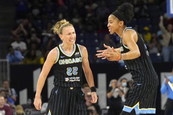 Chicago Sky's Courtney Vandersloot, left, and Candace Parker celebrate after Vandersloot's scored, expanding the lead over the New York Liberty, during the second half in Game 2 of a WNBA basketball first-round playoff series Saturday, Aug. 20, 2022, in Chicago. The Sky won 100-62. (AP Photo/Charles Rex Arbogast)