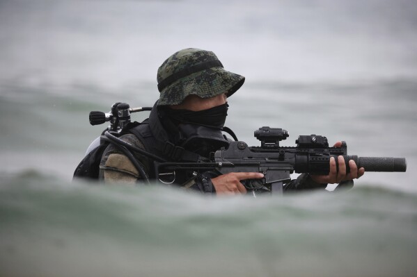 A member of South Korea's Army Special Warfare Command takes part in a joint maritime infiltration training with U.S. Special Operations Command Korea, as part of the Ulchi Freedom Shield (UFS) exercise, at a shore in Yangyang, northern South Korea, Monday, Aug. 28, 2023. (Kim Hong-ji/Pool Photo via AP)