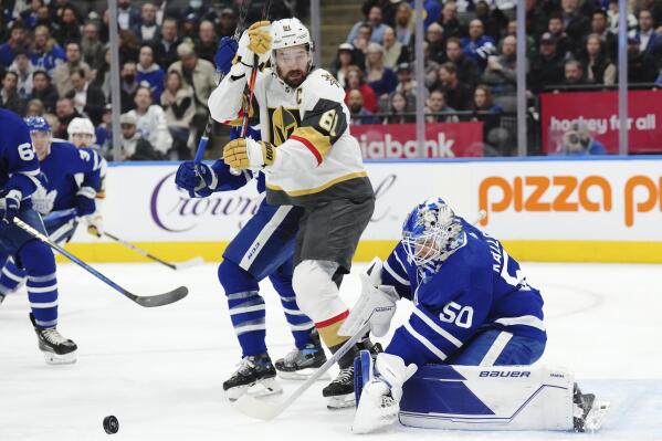 Toronto Maple Leafs goaltender Erik Kallgren (50) makes a save as Vegas Golden Knights forward Mark Stone (61) looks for the rebound during the first period of an NHL hockey game, Tuesday, Nov. 8, 2022 in Toronto. (Nathan Denette/The Canadian Press via AP)