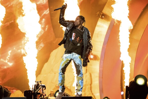 FILE - Travis Scott performs at the Astroworld Music Festival in Houston, Nov. 5, 2021. A Texas grand jury has declined to indict Travis Scott in the criminal investigation into a massive crowd surge that killed 10 people at the 2021 Astroworld music festival in Houston, the rappers attorney said Thursday. (Photo by Amy Harris/Invision/AP, File)