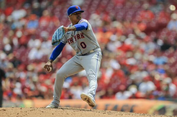 New York Mets' Marcus Stroman throws during the seventh inning of a baseball game against the Cincinnati Reds in Cincinnati, Wednesday, July 21, 2021. (AP Photo/Aaron Doster)