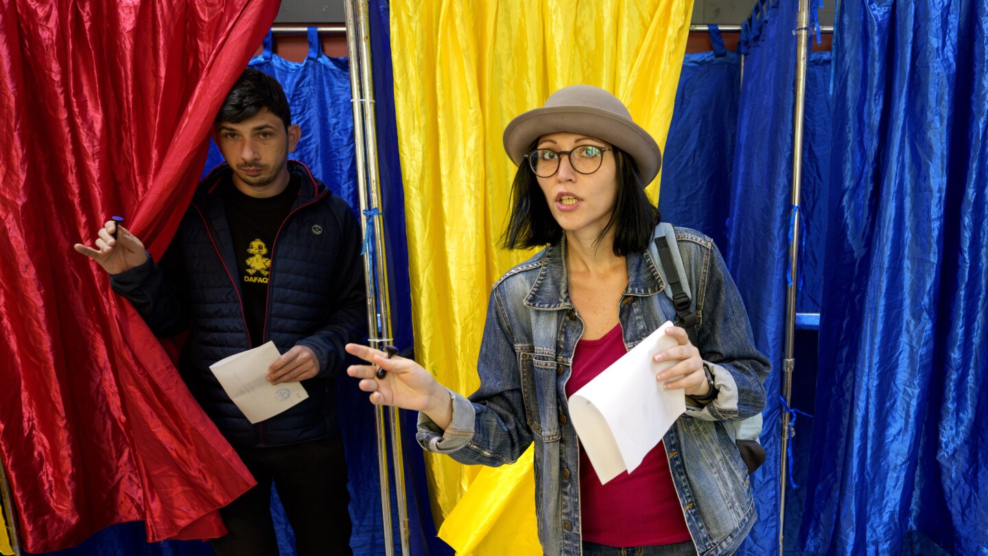 Romanians vote in a tense presidential runoff that pits a nationalist against a pro-EU centrist