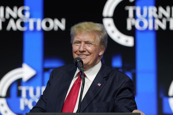FILE - In this July 24, 2021, file photo former President Donald Trump smiles as he pauses while speaking to supporters at a Turning Point Action gathering in Phoenix. As he mulls a comeback run for president in 2024, former President Donald Trump has been wading into local secretary of state and attorney general races in key swing states. (AP Photo/Ross D. Franklin, File)