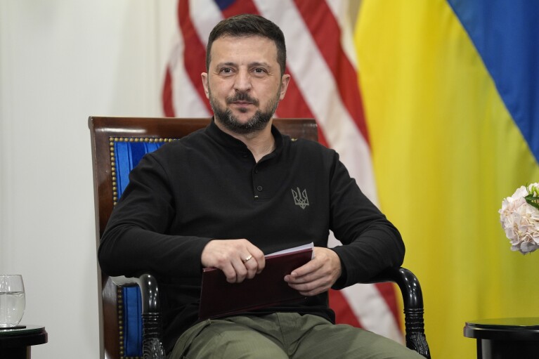 Ukrainian President Volodymyr Zelenskyy looks on during a meeting with U.S. President Joe Biden in Paris, Friday, June 7, 2024. (AP Photo/Evan Vucci)