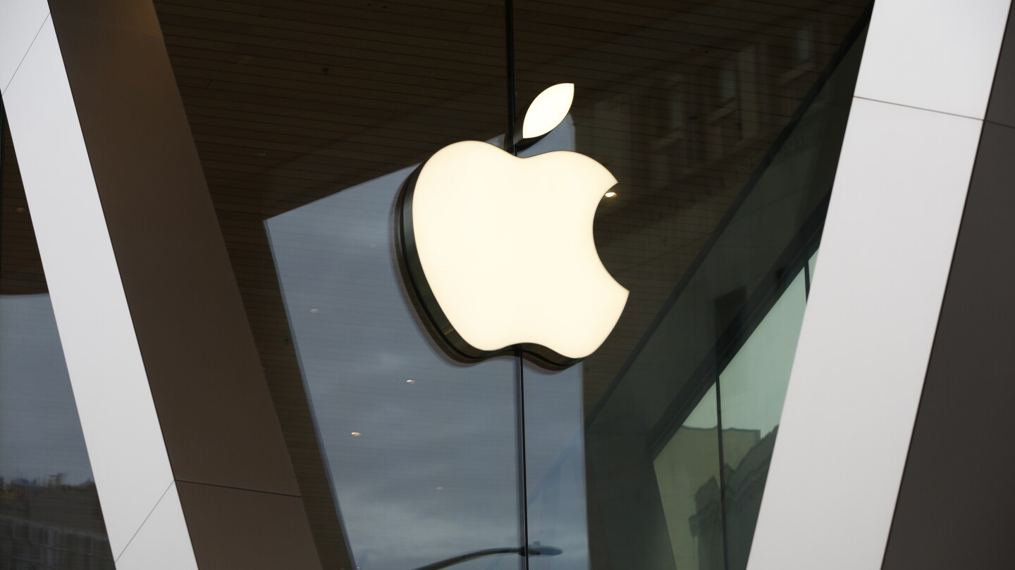 FILE - An Apple logo adorns the facade of the downtown Brooklyn Apple store on March 14, 2020, in New York. Apple is discontinuing its buy now, pay la