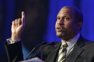 FILE - In this May 29, 2014 file photo, author and talk show host Tavis Smiley speaks at Book Expo America in New York.  A jury on Wednesday found that former talk show host Tavis Smiley violated t...