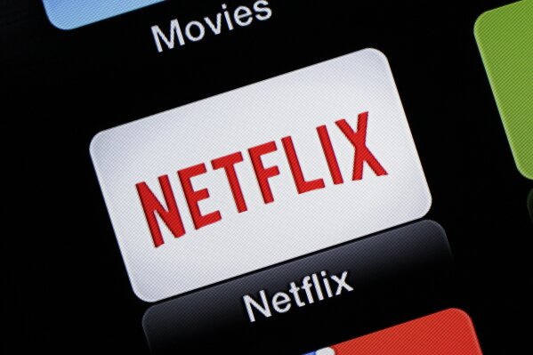 FILE - This June 24, 2015, file photo, shows the Netflix Apple TV app icon, in South Orange, N.J. Netflix reports financial results on Monday, April 18, 2016. Sports are on hold, movie theaters are closed and so are amusement parks. But Americans held captive at home by the coronavirus can turn to Netflix, Amazon, Hulu and other streaming services, outliers in an entertainment industry otherwise brought to an unprecedented standstill. (AP Photo/Dan Goodman, File)