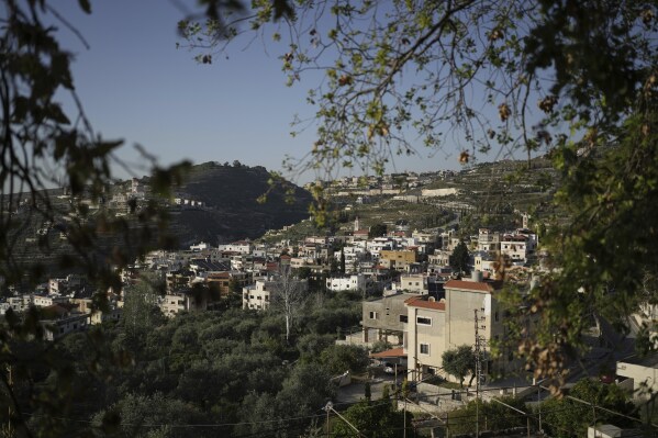 A general view of the village of Quraye, where Christians gathered for Holy Week rituals, near the southern port city of Sidon, Lebanon, Thursday, April 17, 2025. (AP Photo/Hassan Ammar)