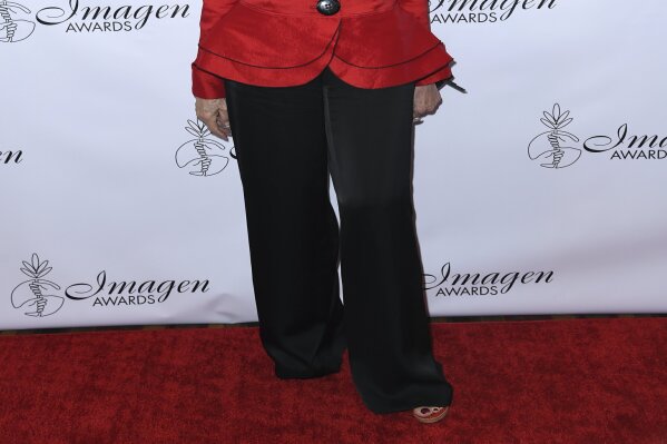 FILE - In this Aug. 25, 2018, file photo, Rita Moreno arrives at the 33rd annual Imagen Awards in Los Angeles. PBS announced Monday, July 29, 2019, it will air a documentary about Moreno, “Rita Moreno: The Girl Who Decided to Go For It,” charting her decades-long career. The project is slated to air in 2020. (Photo by Richard Shotwell/Invision/AP, File)