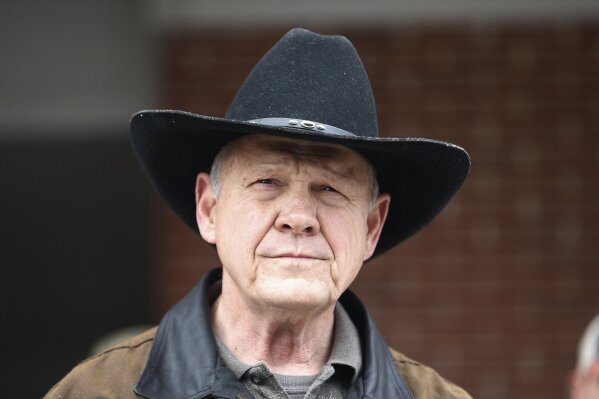 
              FILE - In this Dec. 12, 2017, file photo, Roy Moore speaks to the media after he rode in on a horse to vote in Gallant, Ala. Moore says he’s considering a fresh run for Senate in 2020. That’s prompting national Republican leaders to signal that they’d try again to prevent their party from nominating Moore, who’s denied long-ago sexual impropriety with teenagers. (AP Photo/Brynn Anderson, File)
            