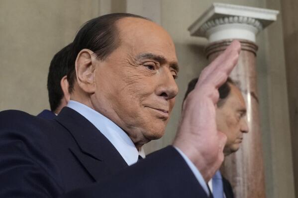 FILE -- Forza Italia president Silvio Berlusconi waves to press as he leaves the Quirinale Presidential Palace in Rome, Friday, Oct. 21, 2022. Doctors caring for Silvio Berlusconi reported a further “constant improvement” in his condition Thursday as he battles to overcome a lung infection and apparent kidney problems caused by chronic leukemia. (AP Photo/Gregorio Borgia,file)