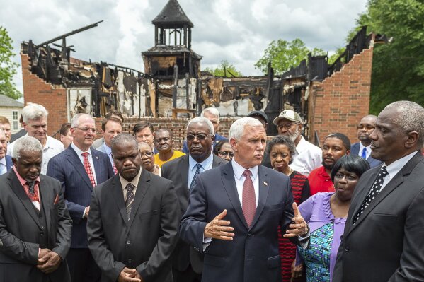 
              Vice President Mike Pence visits with members of the congregation at Mt. Pleasant Baptist Church in Opelousas, La., Friday, May 3, 2019.  (Scott Clause/The Daily Advertiser via AP)
            