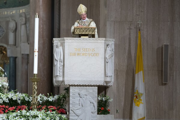 FILE - Archbishop Timothy Broglio conducts an Easter Sunday Mass in an empty sanctuary at Basilica of the National Shrine of the Immaculate Conception in Washington, Sunday, April 12, 2020. For the October 2023 synod at the Vatican, the U.S. delegation consists of members widely viewed as ideological rivals. There are six clerics appointed by Pope Francis who support his aspirations for a more inclusive, welcoming church. And there are five clerics chosen by the U.S. Conference of Catholic Bishops, including its president, Broglio, who reflect a more conservative outlook. (AP Photo/Jose Luis Magana, File)