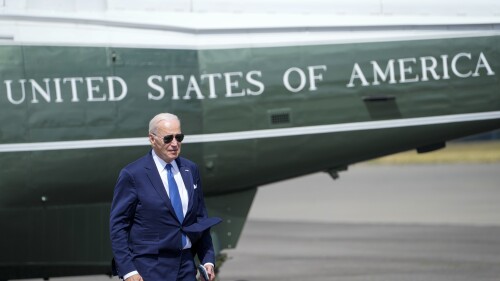 US President Joe Biden walks backdropped by Marine One upon arriving at Stansted airport, in London, Monday, July 10, 2023. (AP Photo/Susan Walsh)