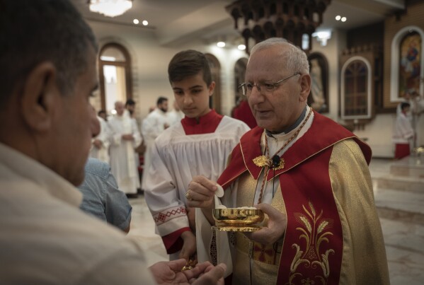 Chaldean Patriarch Louis Sako holds service at Mar Youssef Cathedral in Irbil, Iraq, Sunday, July 30, 2023. Last month, Sako announced that he would withdraw from the patriarchal headquarters in Baghdad and relocate to northern Iraq's semi-autonomous Kurdish region after the Iraqi President revoked a decree recognizing his position. (AP Photo/Julia Zimmermann/Metrography)